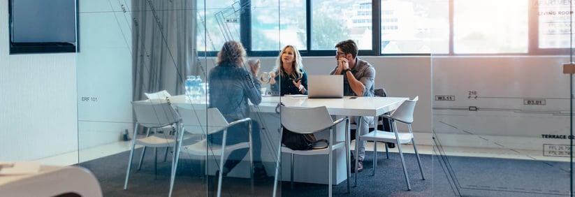 three people planning in an office